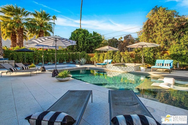 view of swimming pool with a patio