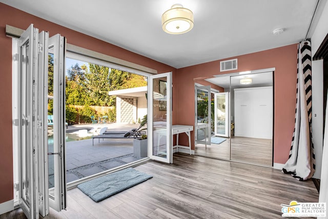 doorway to outside featuring hardwood / wood-style floors