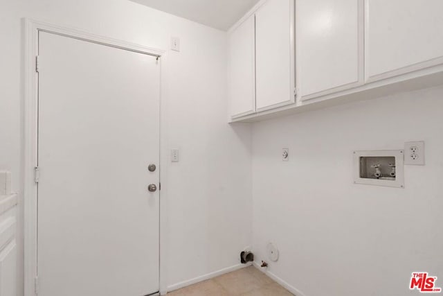 washroom featuring electric dryer hookup, gas dryer hookup, cabinets, and hookup for a washing machine