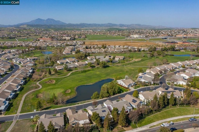 drone / aerial view featuring a water and mountain view