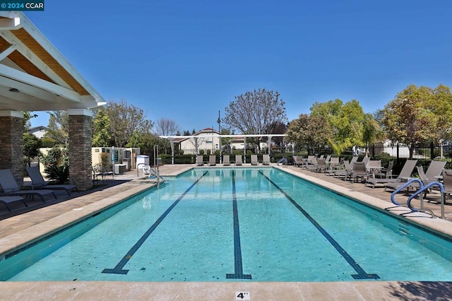 view of swimming pool with a patio area