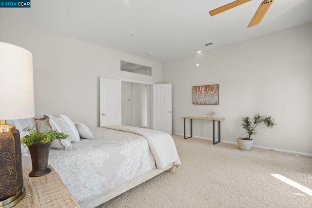 bedroom featuring ceiling fan and light colored carpet