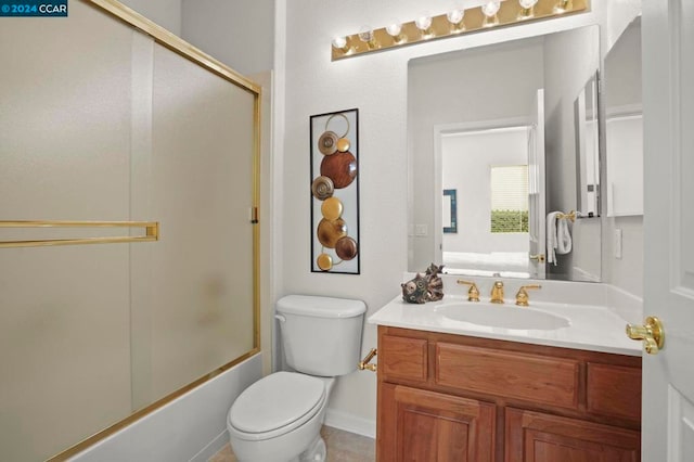 full bathroom with vanity, toilet, and shower / bath combination with glass door