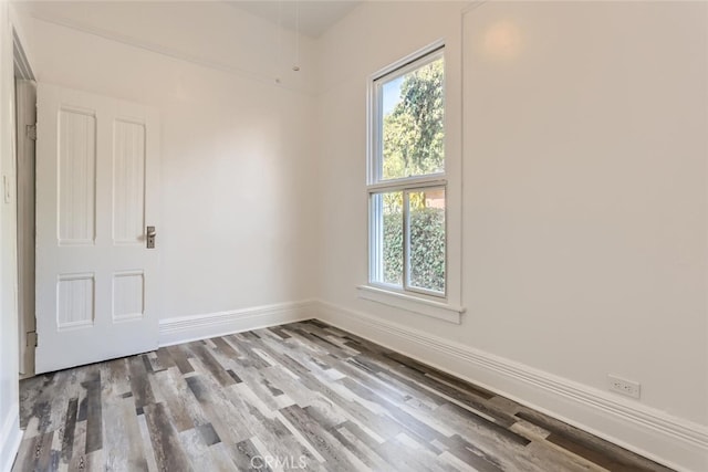 spare room with light hardwood / wood-style floors