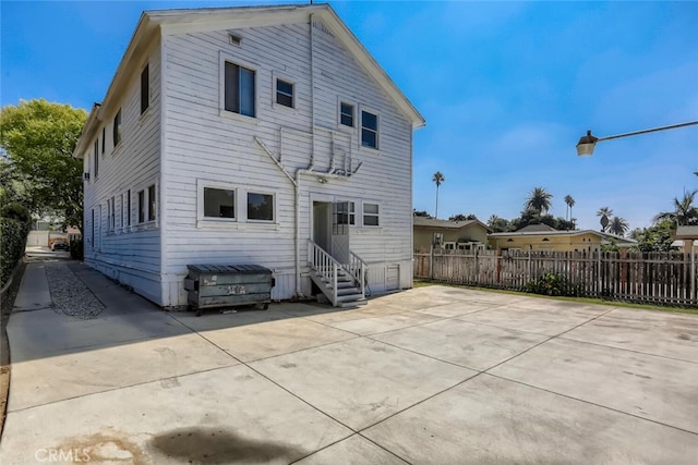 rear view of property featuring a patio