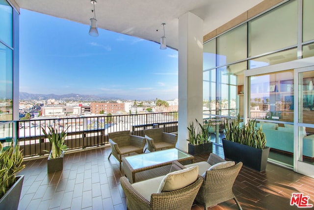 balcony featuring a mountain view