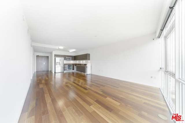 unfurnished living room featuring light wood-type flooring