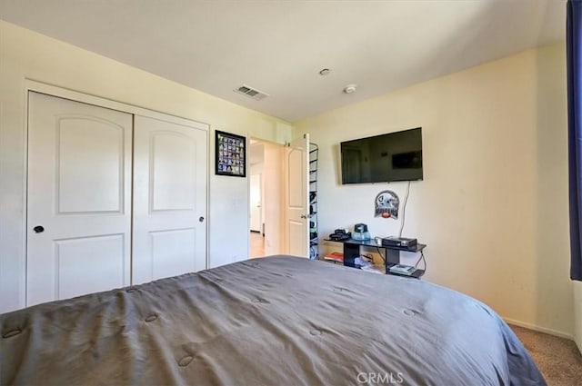 bedroom featuring a closet and carpet