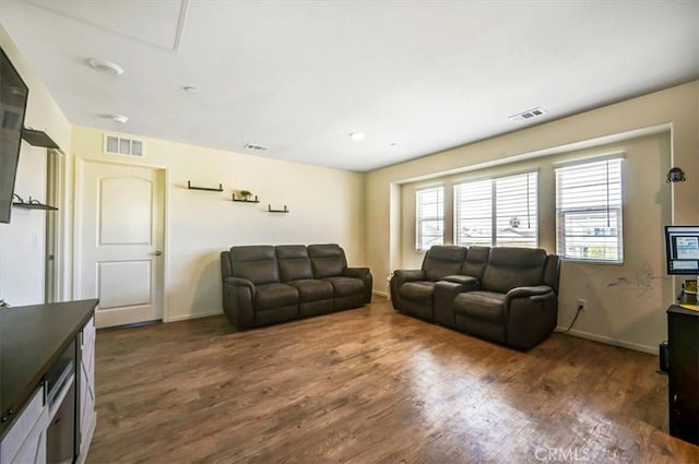 living room with dark hardwood / wood-style floors