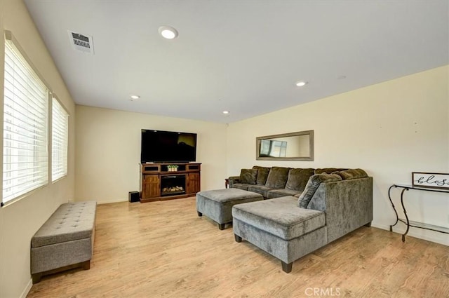 living room with light hardwood / wood-style flooring