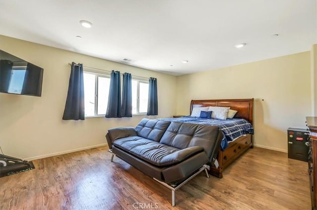 bedroom featuring wood-type flooring