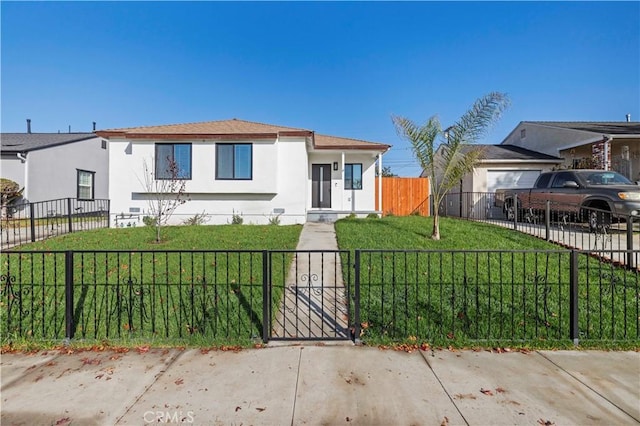 bungalow-style house featuring a front lawn