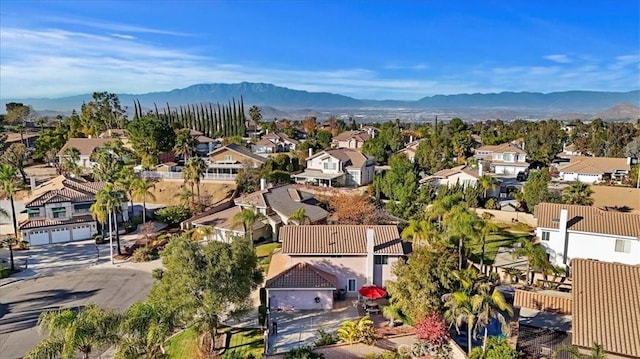 birds eye view of property with a mountain view