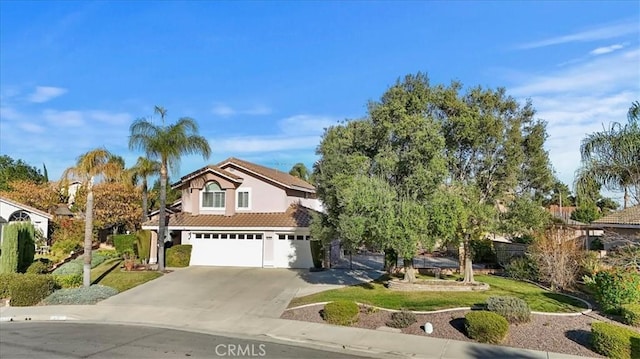 view of front facade with a garage and a front yard