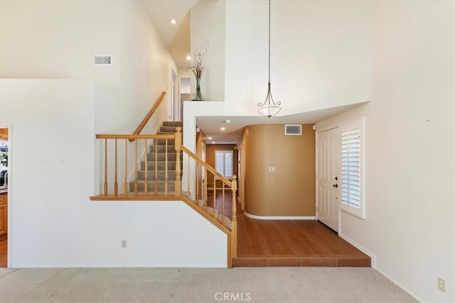 interior space with a towering ceiling