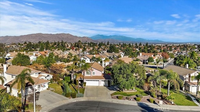 birds eye view of property with a mountain view