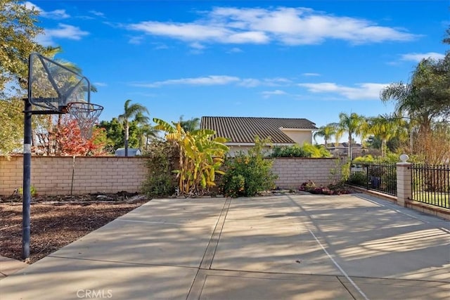 view of patio / terrace featuring basketball hoop