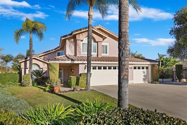 view of front of home featuring a front yard and a garage