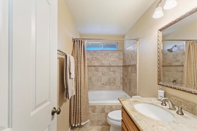 full bathroom with tile patterned floors, vanity, shower / bath combo, and toilet