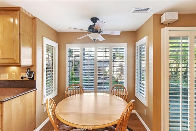 dining space featuring ceiling fan and plenty of natural light