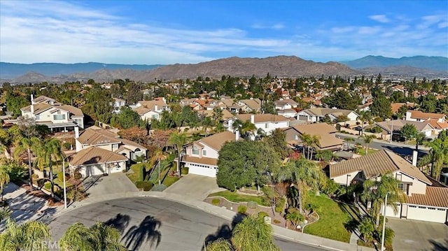 birds eye view of property featuring a mountain view