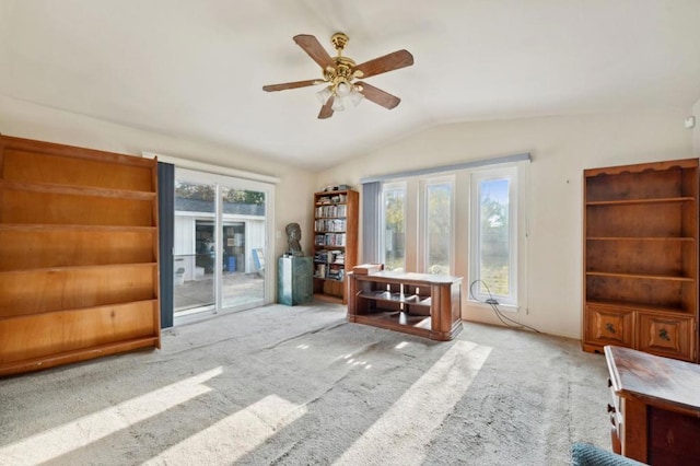 interior space with vaulted ceiling, plenty of natural light, and ceiling fan