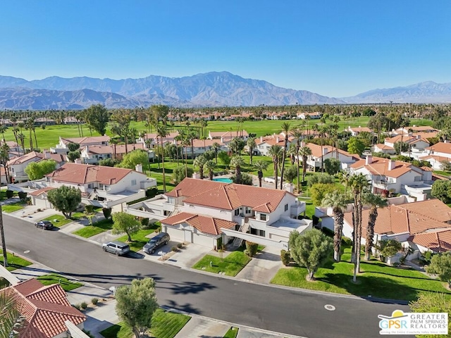 drone / aerial view featuring a mountain view