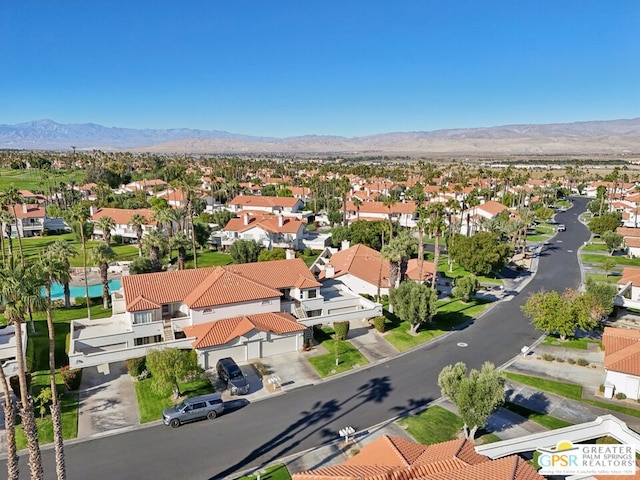 birds eye view of property featuring a mountain view