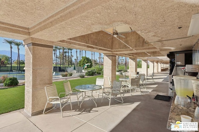 view of patio featuring ceiling fan