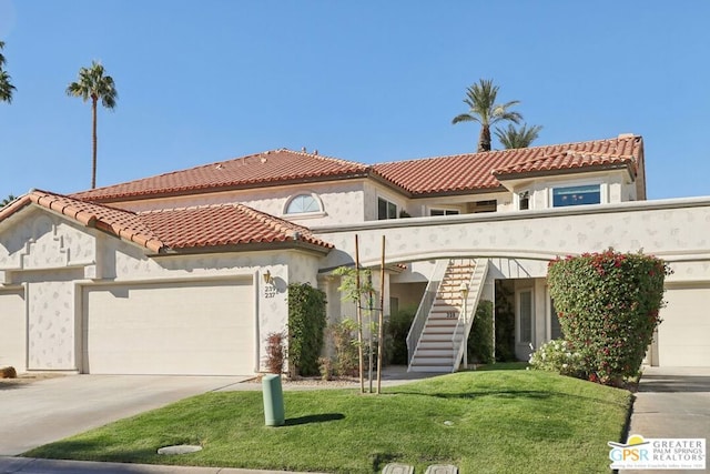 mediterranean / spanish-style house with a garage and a front lawn