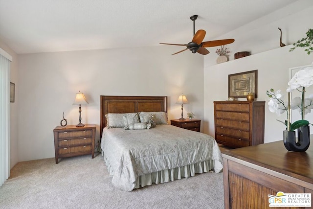 bedroom featuring ceiling fan, light carpet, and vaulted ceiling