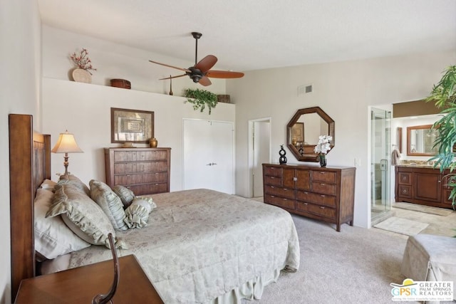 carpeted bedroom featuring ensuite bathroom, ceiling fan, and high vaulted ceiling