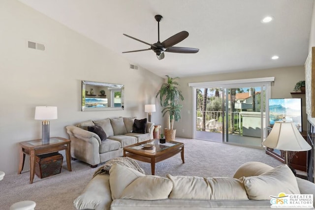 carpeted living room featuring ceiling fan and high vaulted ceiling