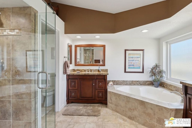 full bathroom featuring toilet, vanity, and shower with separate bathtub