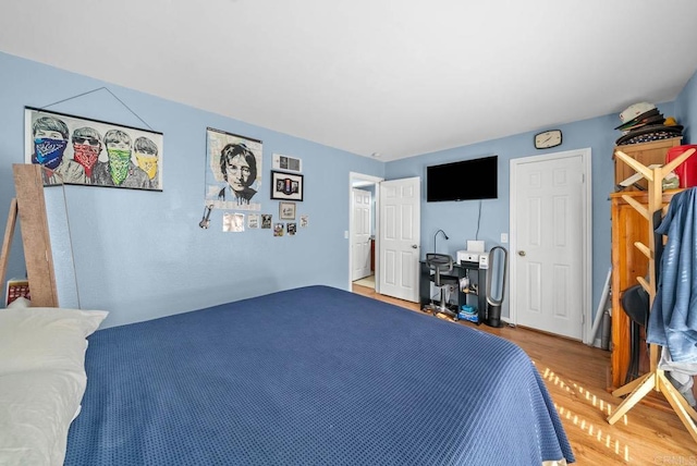 bedroom featuring hardwood / wood-style floors