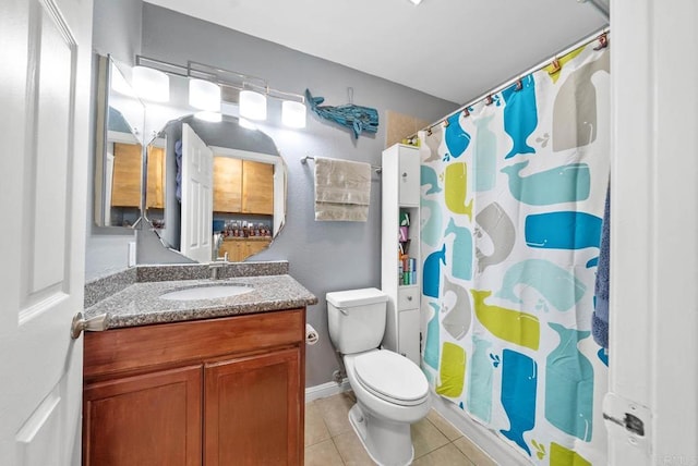 bathroom featuring tile patterned floors, vanity, a shower with shower curtain, and toilet