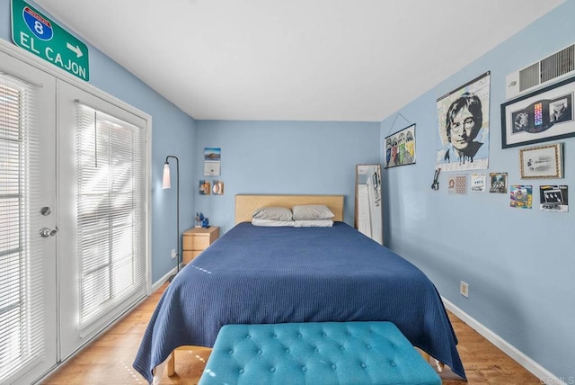 bedroom with hardwood / wood-style flooring