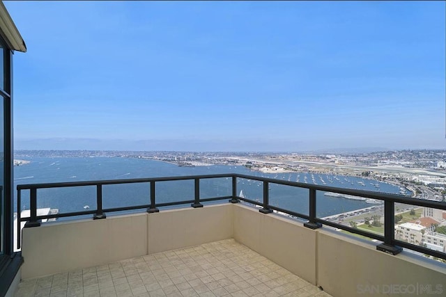 balcony featuring a water view