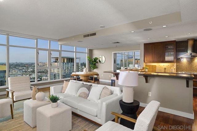 living room with dark hardwood / wood-style flooring