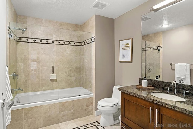 full bathroom with vanity, bath / shower combo with glass door, tile patterned floors, and toilet