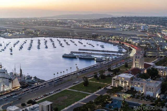 aerial view at dusk with a water view