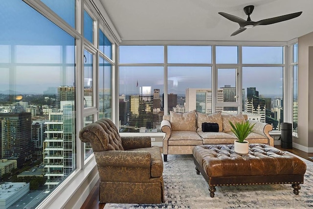 sunroom featuring ceiling fan