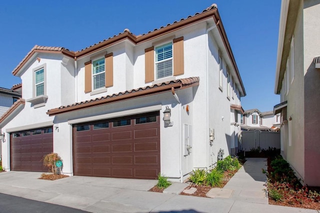 mediterranean / spanish-style house featuring a garage