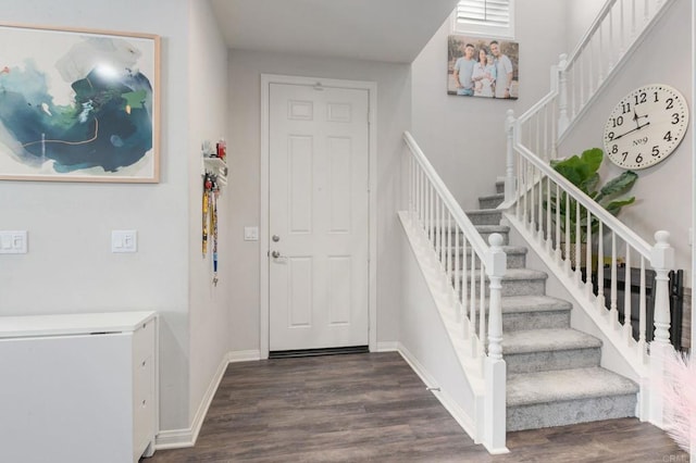 stairway featuring hardwood / wood-style flooring