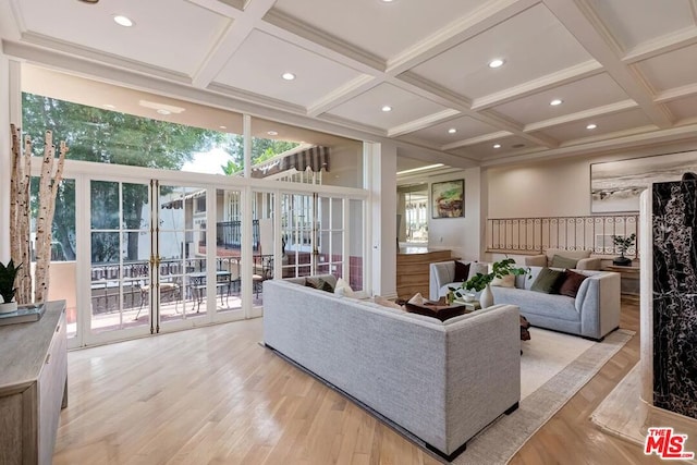 living room featuring beamed ceiling, light hardwood / wood-style flooring, and coffered ceiling