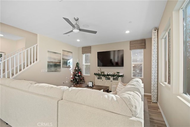 living room with hardwood / wood-style floors and ceiling fan