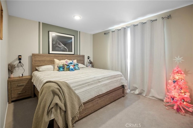 bedroom featuring light colored carpet