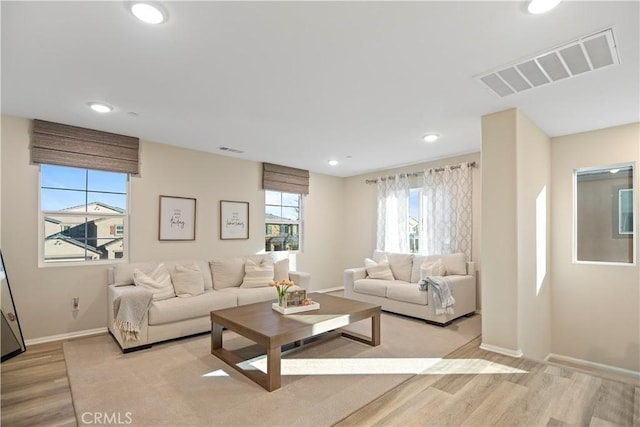 living room with light hardwood / wood-style flooring