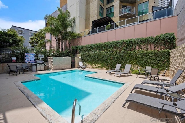 view of pool featuring a patio area