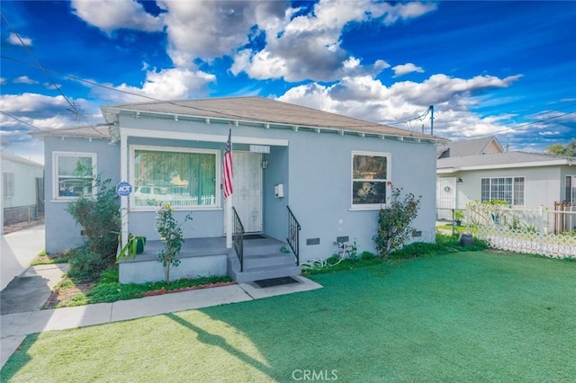 view of front facade with a front yard